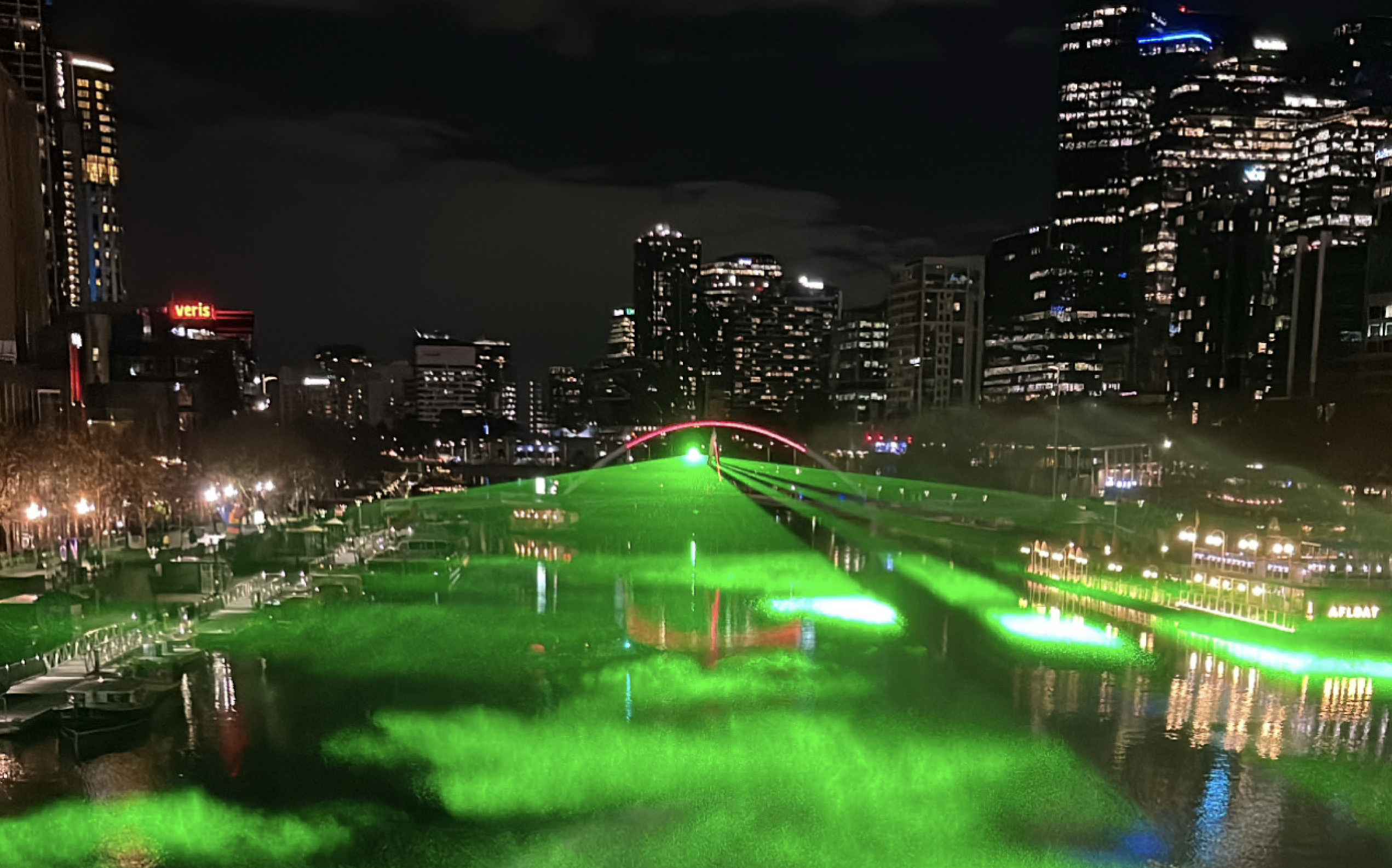 A giant laser beam lights up the Yarra River for Rising Festival